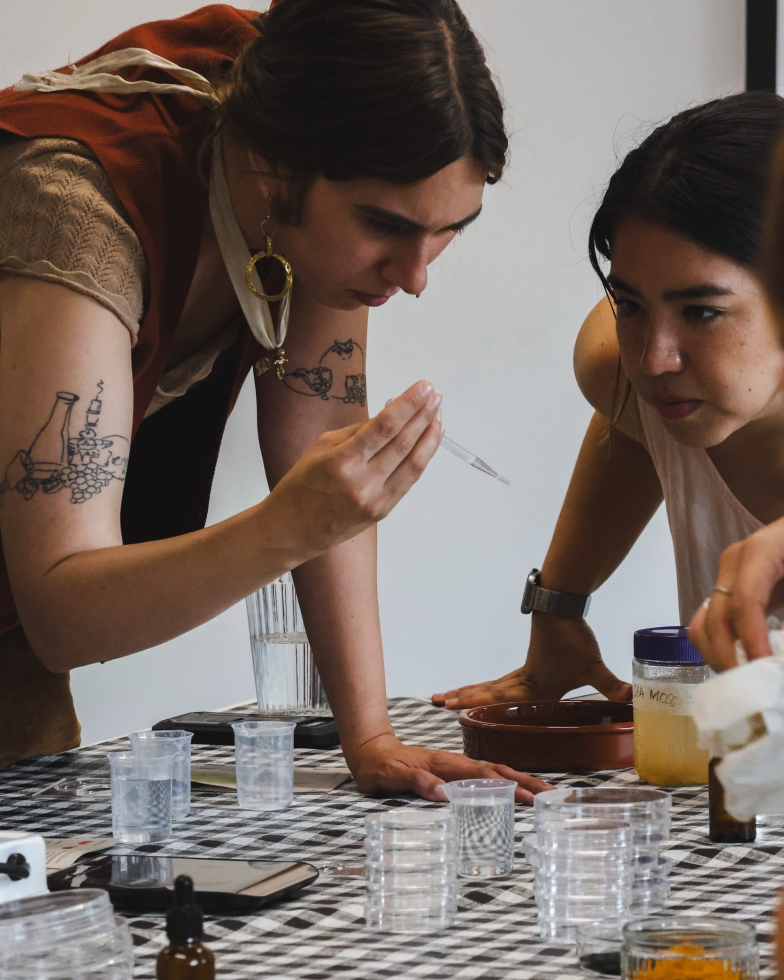 Two workshop participants examining a sample together